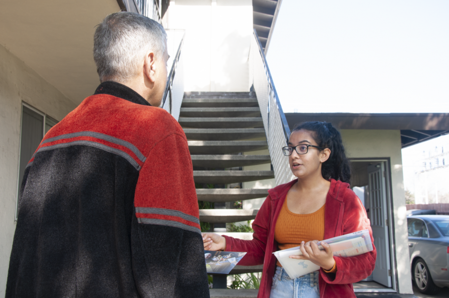 Senior Rukmini Banerjee informs a Sunnyvale resident about the California primary process.