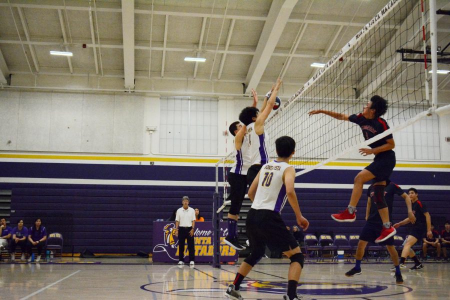 Senior Daniel Chang and junior Brandon Ng successfully block a spike by a Lynbrook HS player. The duo amounted for multiple blocks during the game.  