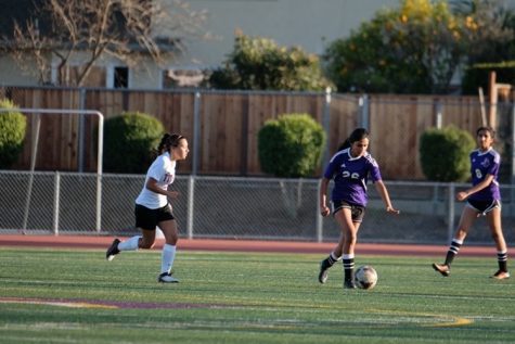 Ramanathan kicks the ball at a soccer game. Photo used with permission from Viveka Ramanathan.