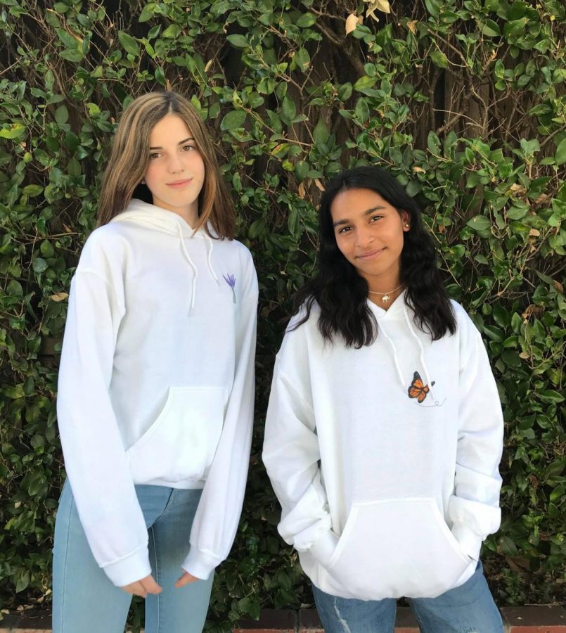 Sophomores Angela Doncsev and Nikita Swaminathan model the Lav and Butterfly hoodies.