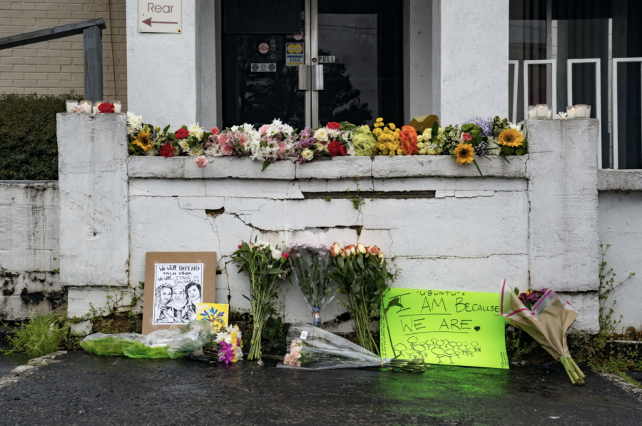 Mourners place flowers outside one of the spas targeted in the Atlanta shooting