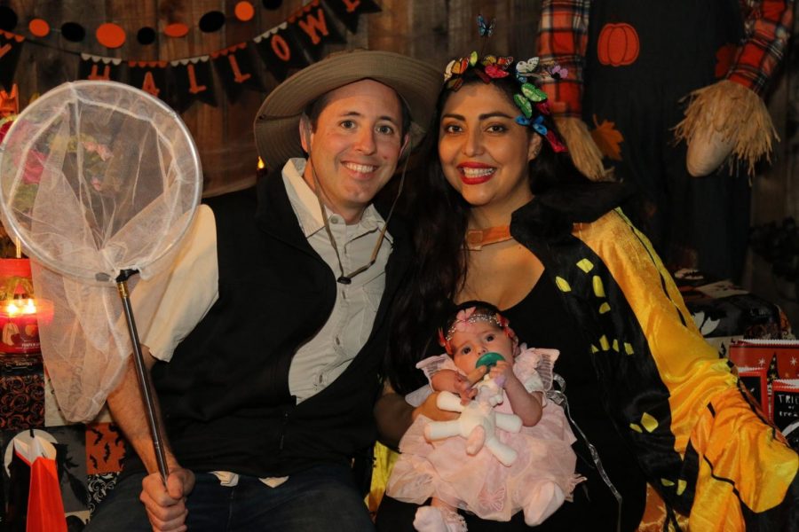 Victorine poses with his family on Halloween