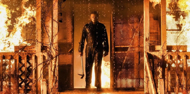 Michael Myers (James Jude Courtney) stands in front of a burning house in the film’s opening scene. Photo courtesy of Universal Pictures