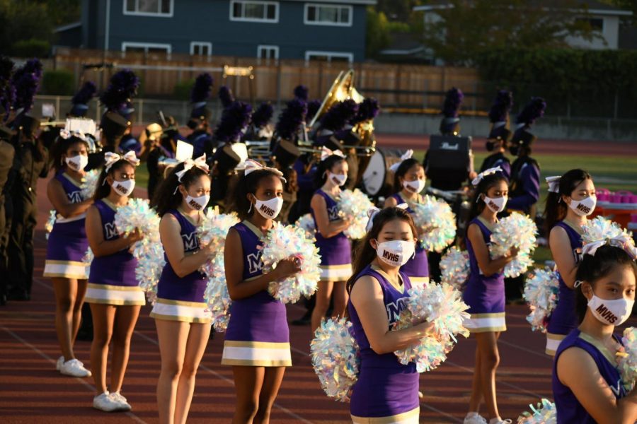 Cheerleaders line up on the sidelines during the game against Lowell High School, in which the Matadors fell 53-14. 