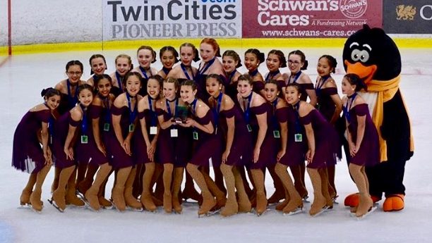 Senior Sophia Chen takes a photo with her team during the competition, Ice Sports Industry Worlds, in Minneapolis, Minnesota.