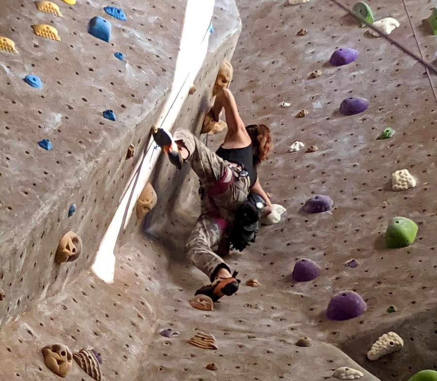 MVHS alum Maya Tate 20 scales the rock wall in September 2021.
