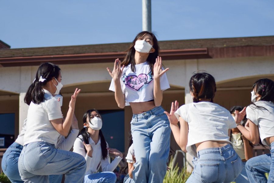 Korean Club's Dance Crew performs a circular pose from K-pop group TWICE's "What is Love" in MVHS's Duo Rally. Photo by Krish Dev