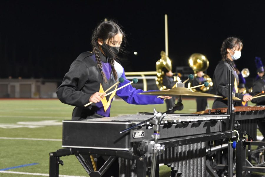 Sophomore Katherine Li plays the vibraphone as a member of the Front Ensemble at Marching Band’s last run-through of their Fall 2021 Show.
