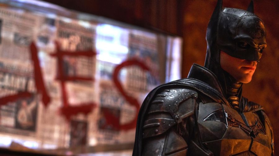 The Batman investigates a crime scene and searches for clues. Photo | Warner Bros.
