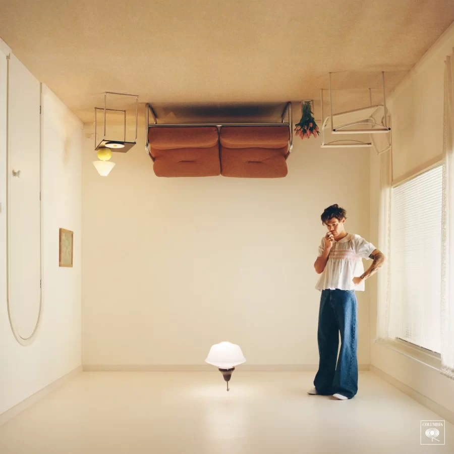 The Harrys House album cover features Styles in a brightly lit, upside down room.