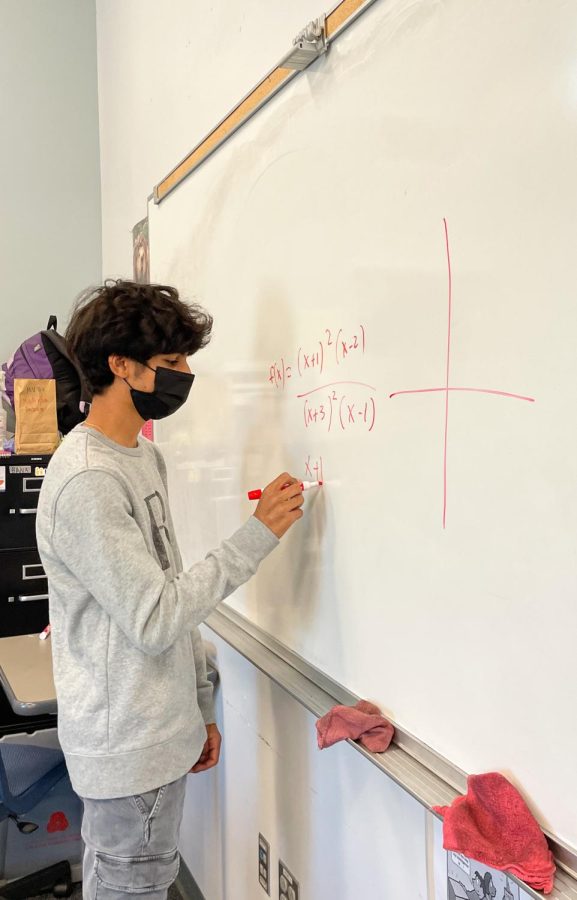 Amish Tyagi works out a math problem in preparation for an upcoming test. Photo by Stephanie Zhang