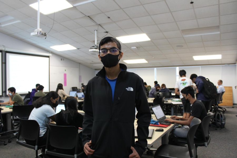 Senior Aakash Kumar poses in a computer science classroom. Photo by Aashi Venkat
