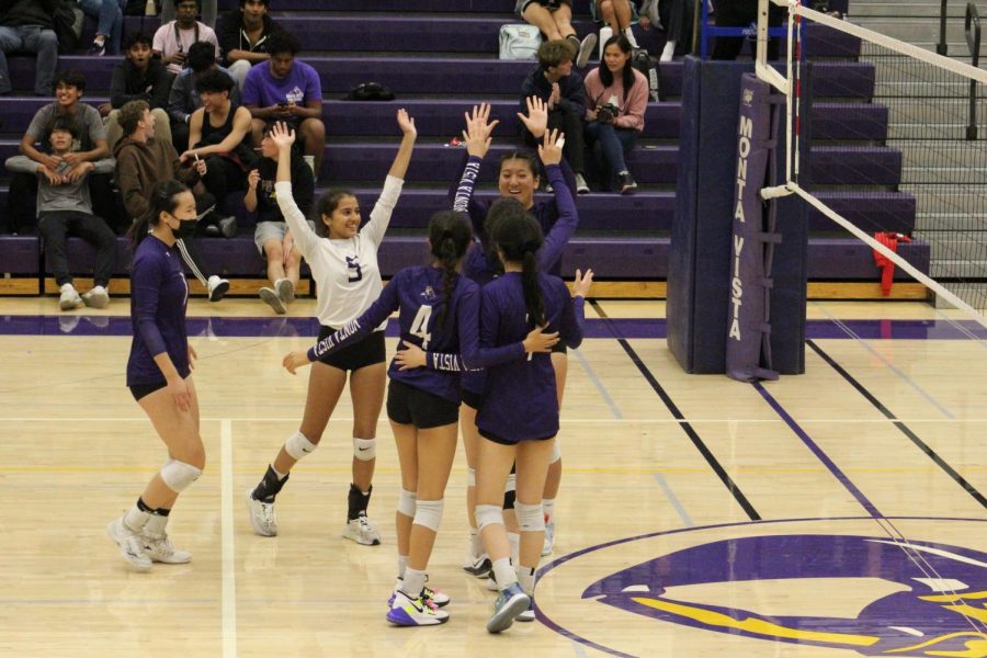 The team celebrates after winning the third set and qualifying for the CCS Semifinals.