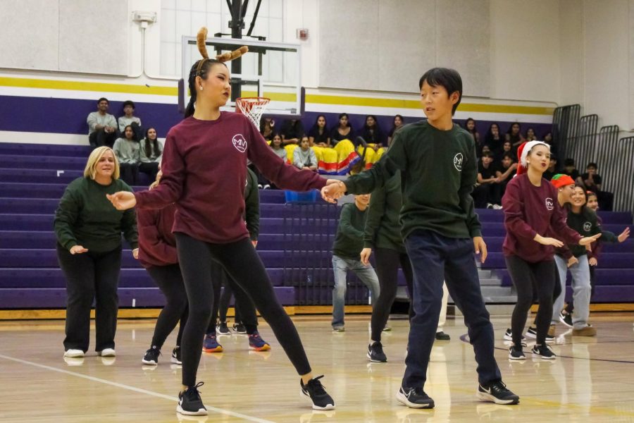 Sophomore Lotus Wu dances with her brother in the first annual Family Jam, a group dance featuring MVDT members and their families. 