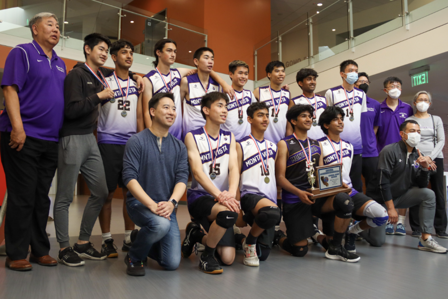 Sophomore and libero Praneel Shah kneels in front row, third from left, after the Varsity Boys Volleyball team won CCS Finals. 