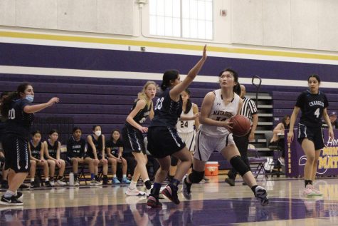 Junior and center forward Sophia Lu maneuvers past the opposition in an attempt to shoot the ball. 

