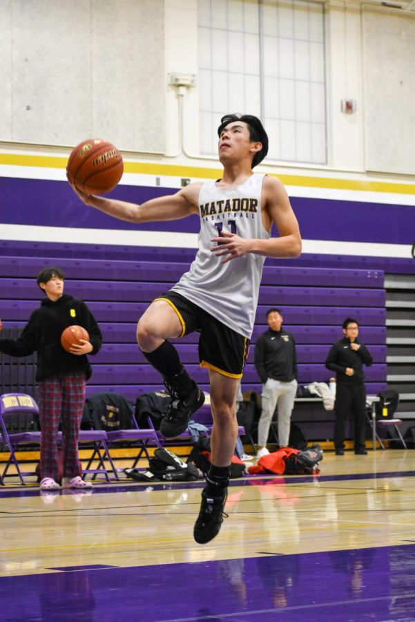 Junior Jake Nakamura performs a layup in the Varsity Boys Basketball team’s game against Milpitas High School on Friday, Jan. 20, which MVHS lost 58-51. The team’s league record is currently 4-5.