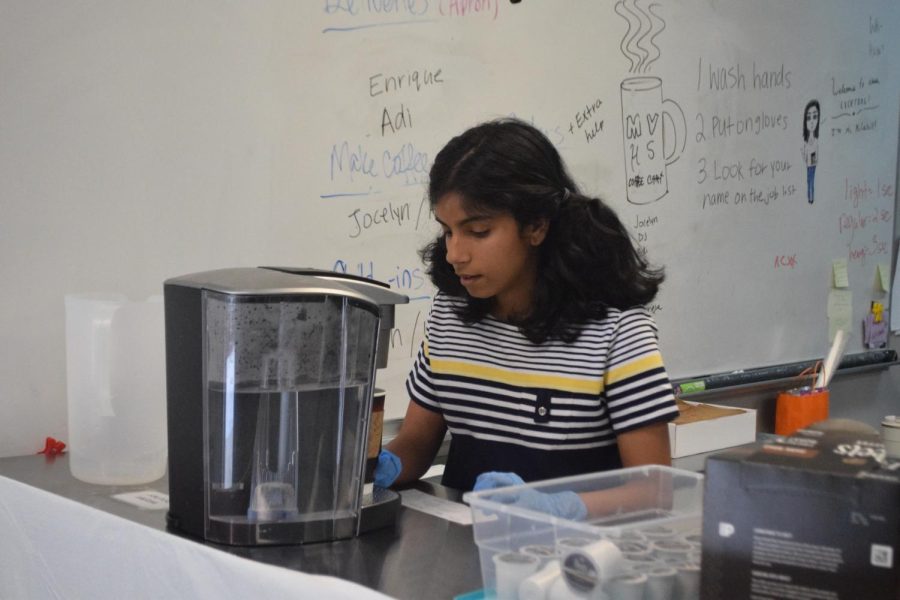 Senior Aarthi Krishnan brews coffee during her ACT vocational class. Photo by Kathryn Foo