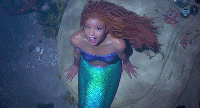 Ariel (Halle Bailey)  sings about wishing to explore life above the ocean in Part of That World.