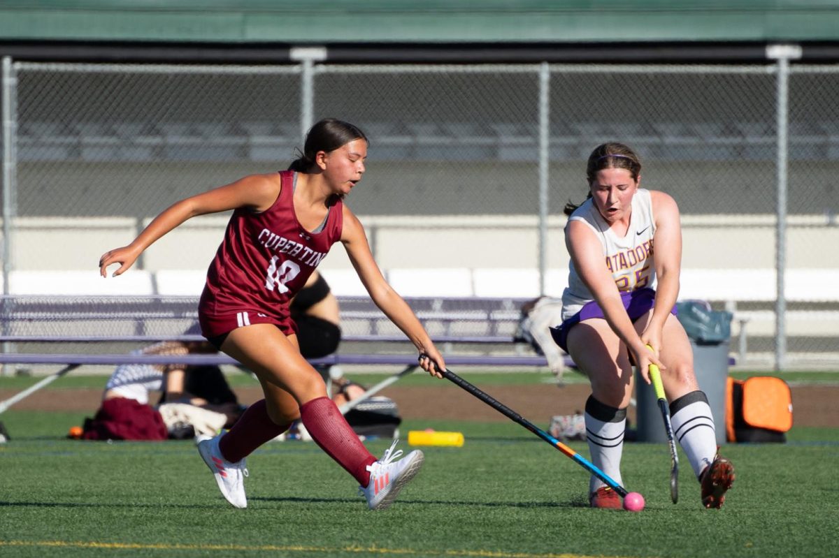 An+opponent+moves+to+take+possession+of+the+ball+from+junior+Erin+Handelsman.+Photo+by+Ethan+Eisler