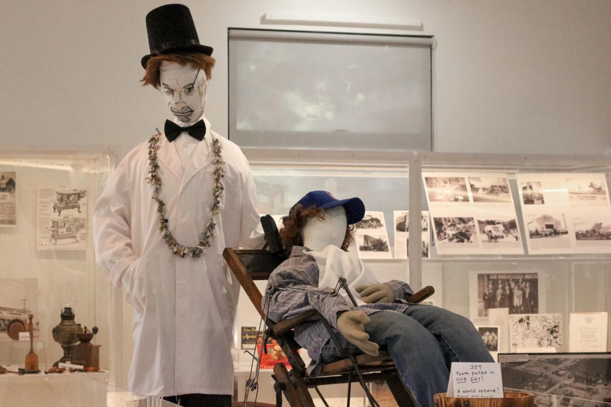 The Cupertino Historical Society acquired two mannequins for the center display: one of Painless Parker, and one of a patient getting his teeth pulled.