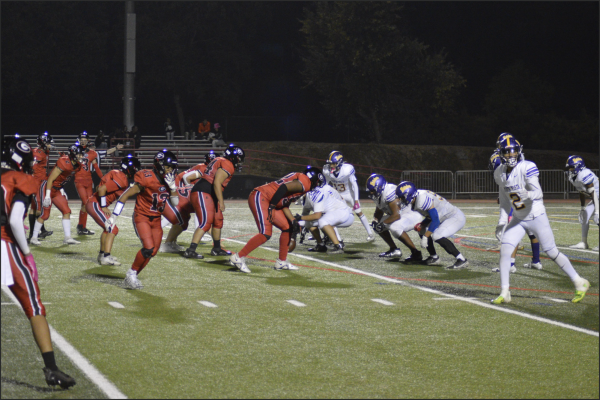 Senior Maaz Zafar (right) gets into position with the rest of the team to run to the other side of the field and catch the ball. 