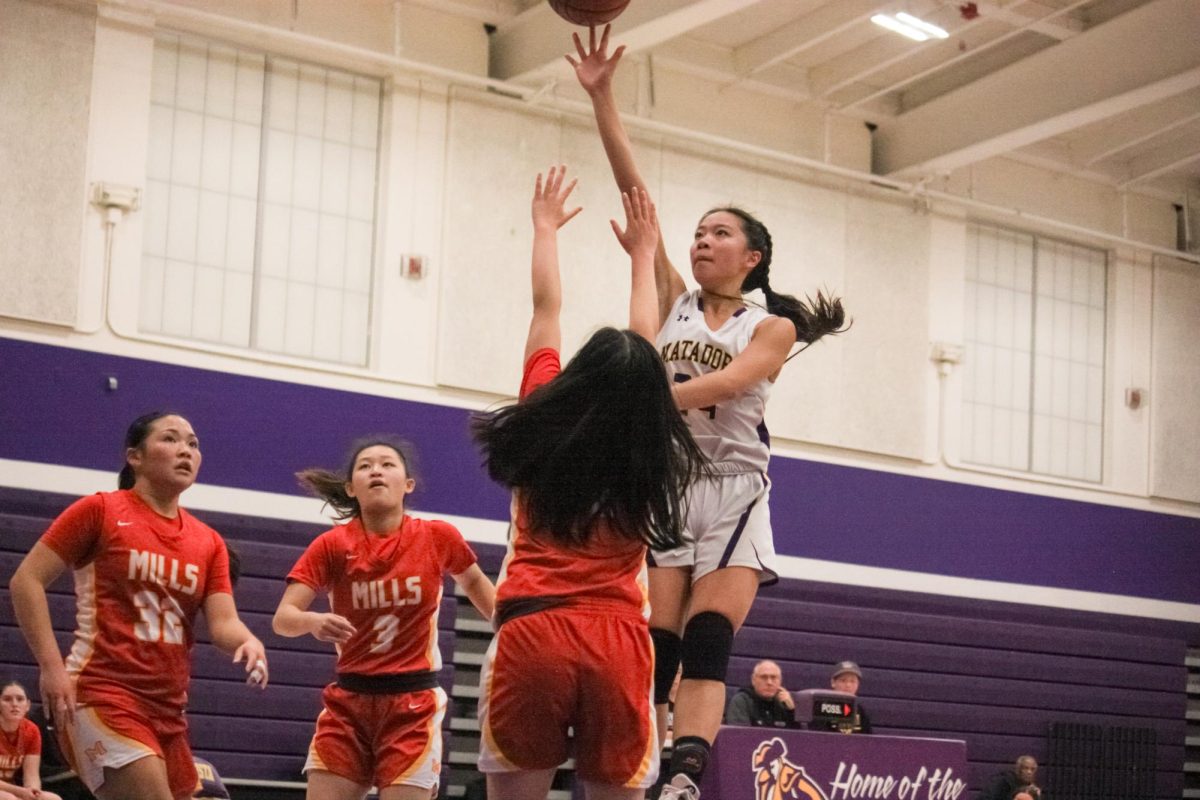 Junior Clara Fun jumps to shoot the ball during a varsity girls basketball game.