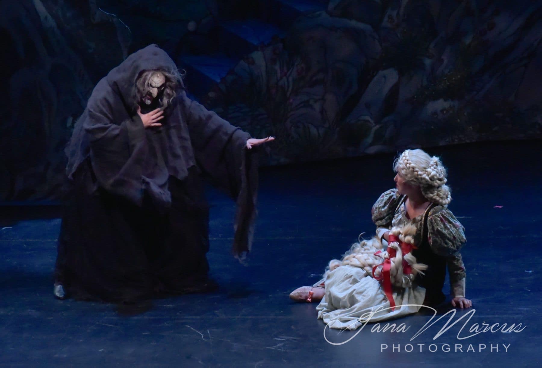 Vocal Music Director Amy Young faces the Witch as she plays “Rapunzel” in a production of “Into the Woods” hosted by San Jose State University’s School of Music and Dance. 
Photo by Jana Marcus Photography | Used with permission