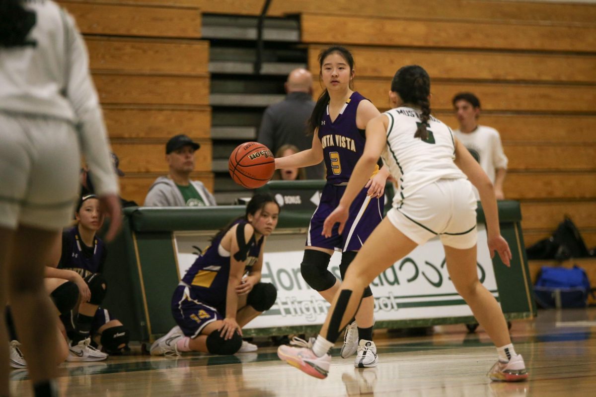 Senior and guard Lindsey Tang looks to pass the ball to a teammate during the fourth quarter. 