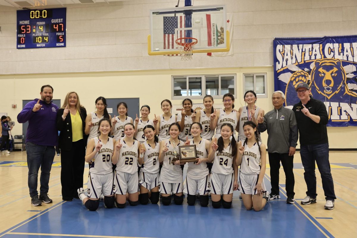The Girl’s Basketball Team pose for a team photo after winning the CCS finals against Christopher high school. Photo courtesy of Clara Fan
