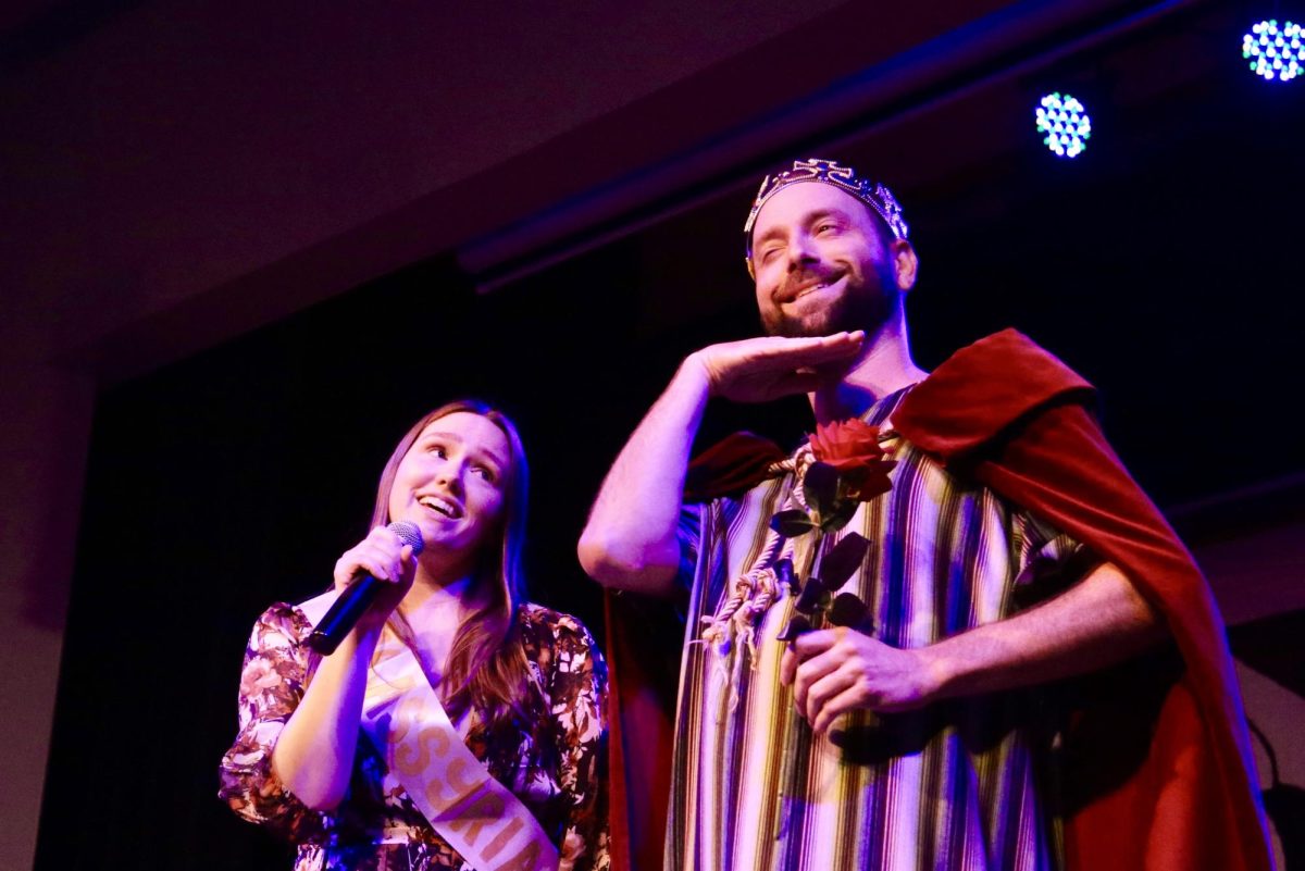 Sarah Howell (Carshena) tries to win Sam Putney (King Ahasuerus) over by singing “You Belong with Me.” Photo by Isabelle Kok.