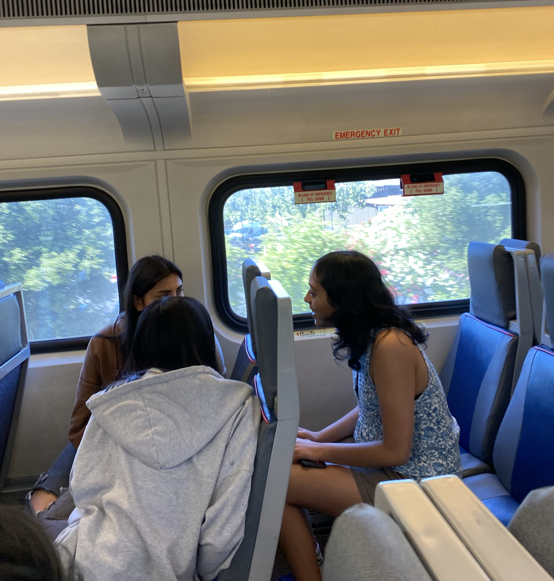 Burji converses with her friends on the Caltrain on the way to San Francisco | Photo courtesy of Aarna Burji
