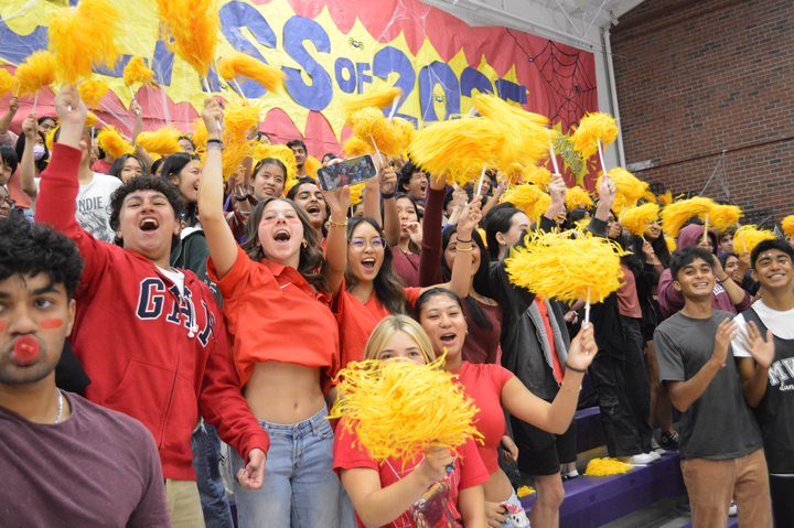 The Class of 2025 cheers with pom poms during the Welcome Back Rally. 
