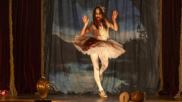 Abigail (Alisha Weir) dances onstage while covered in her victims blood. | Universal Pictures