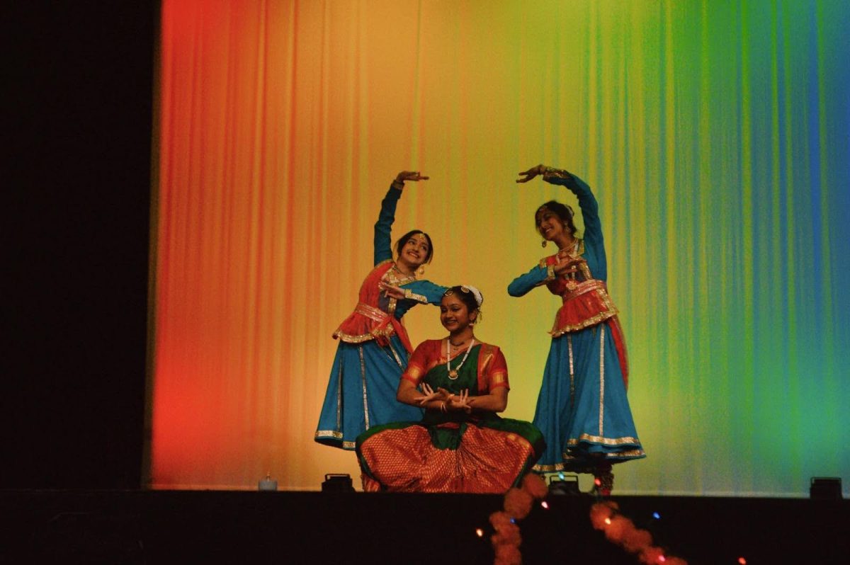 Seniors Vrinda Inani, Pranati Kotamraju and Vanshika Turkar pose at the end of their Bharatnatyam-Kathak fusion dance at MVHS IASA’s Spotlite on India. | Photo by Lily Jiang
