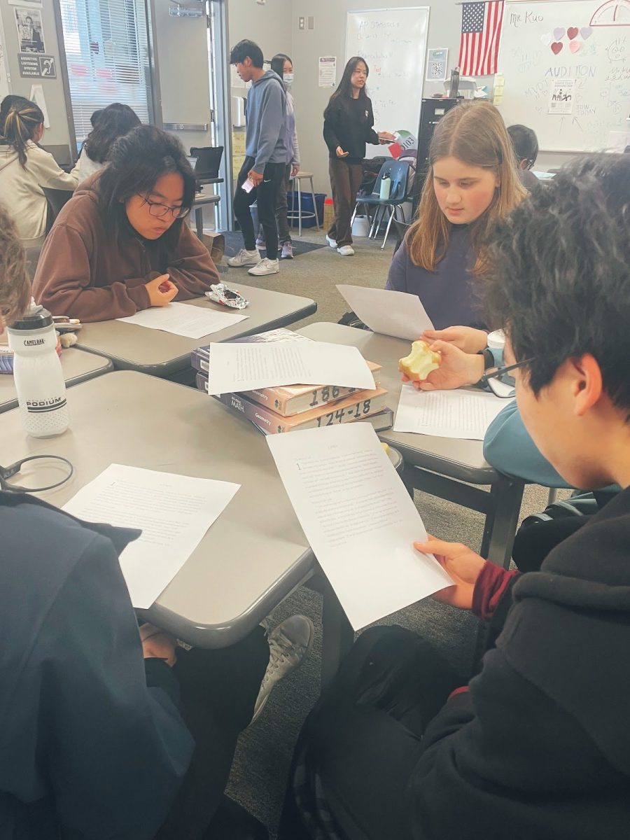 Sophomore Michael Yeung leads a group discussion on a passage from the Bible. | Photo by Lindsey Tang