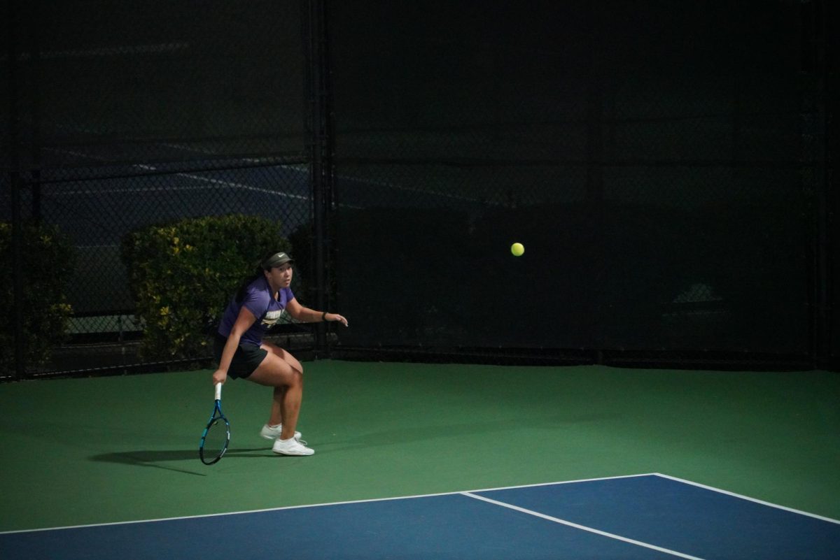 Junior Lucy Yung prepares to strike the ball at a game in the CCS Finals on Nov. 11, 2023.