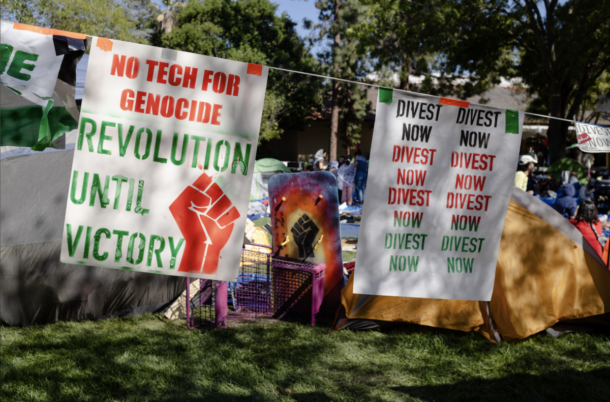 Pro-Palestine protesters at Stanford set up an encampment on White Plaza, covering the outer border with handmade posters and signs.