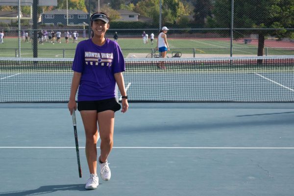 Sophomore Jillian Yang shows a smile after a point during a tennis game. Used with permission from Jillian Yang. 
