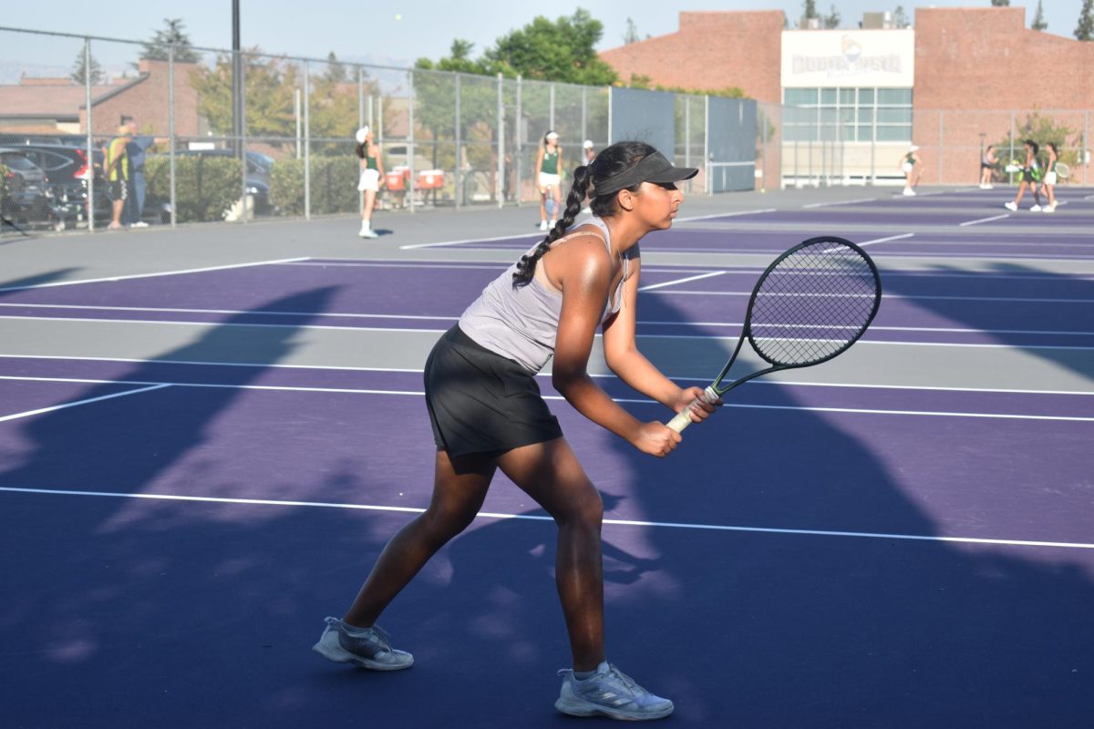 Senior Varsha Iyengar stands ready to receive a serve. 
