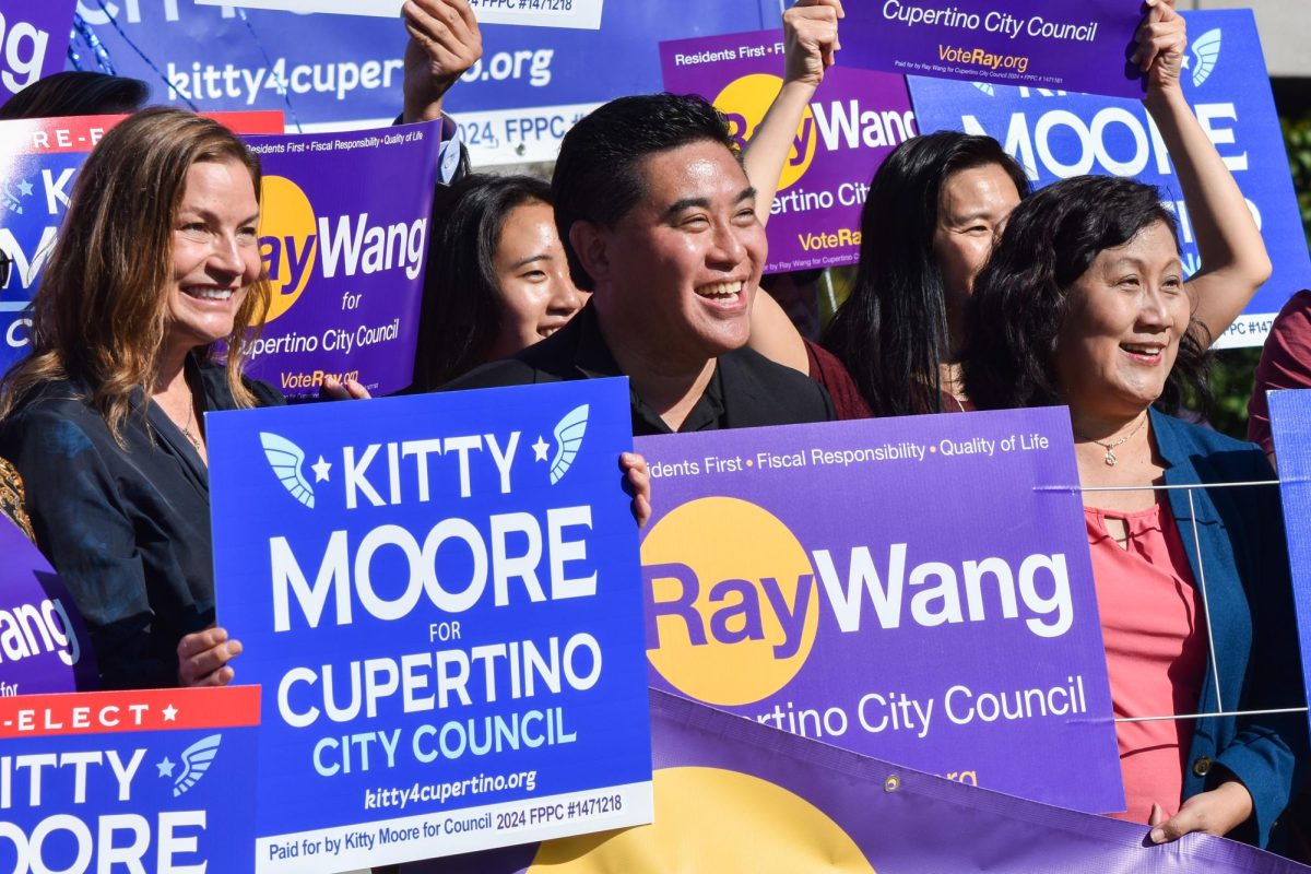 Cupertino City Council candidates Kitty Moore and Ray Wang pose with Councilwoman Liang Chao and supporters at the end of the rally. Photo by Sophia D’Sa