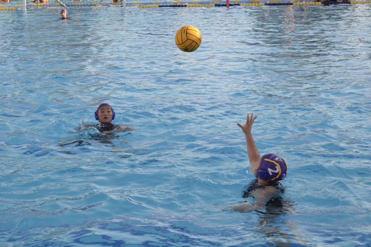 Junior Zoe Yu tosses the ball to junior Miya Sakurai.