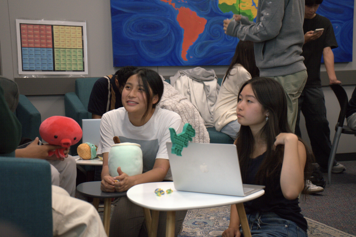 Global Friendship Club officers Luna Endo and Nanako Takamatsu gather during the first meeting of the school year. 