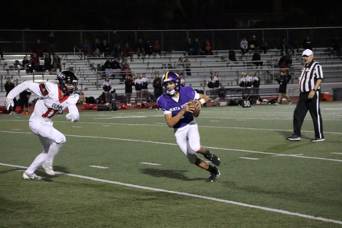 Junior and running back/strong safety Justin Chaahoub runs with the ball while trying to evade the GHS defensive players. 