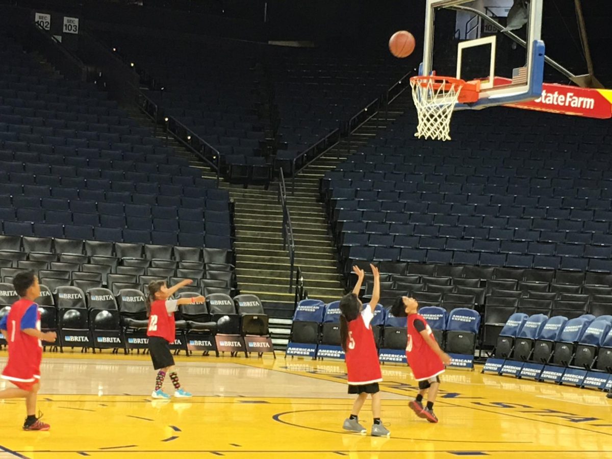 Junior Miya Sakurai and her Asian league team play on the court at Oracle Arena. Photo courtesy of Miya Sakurai | Used with permission.