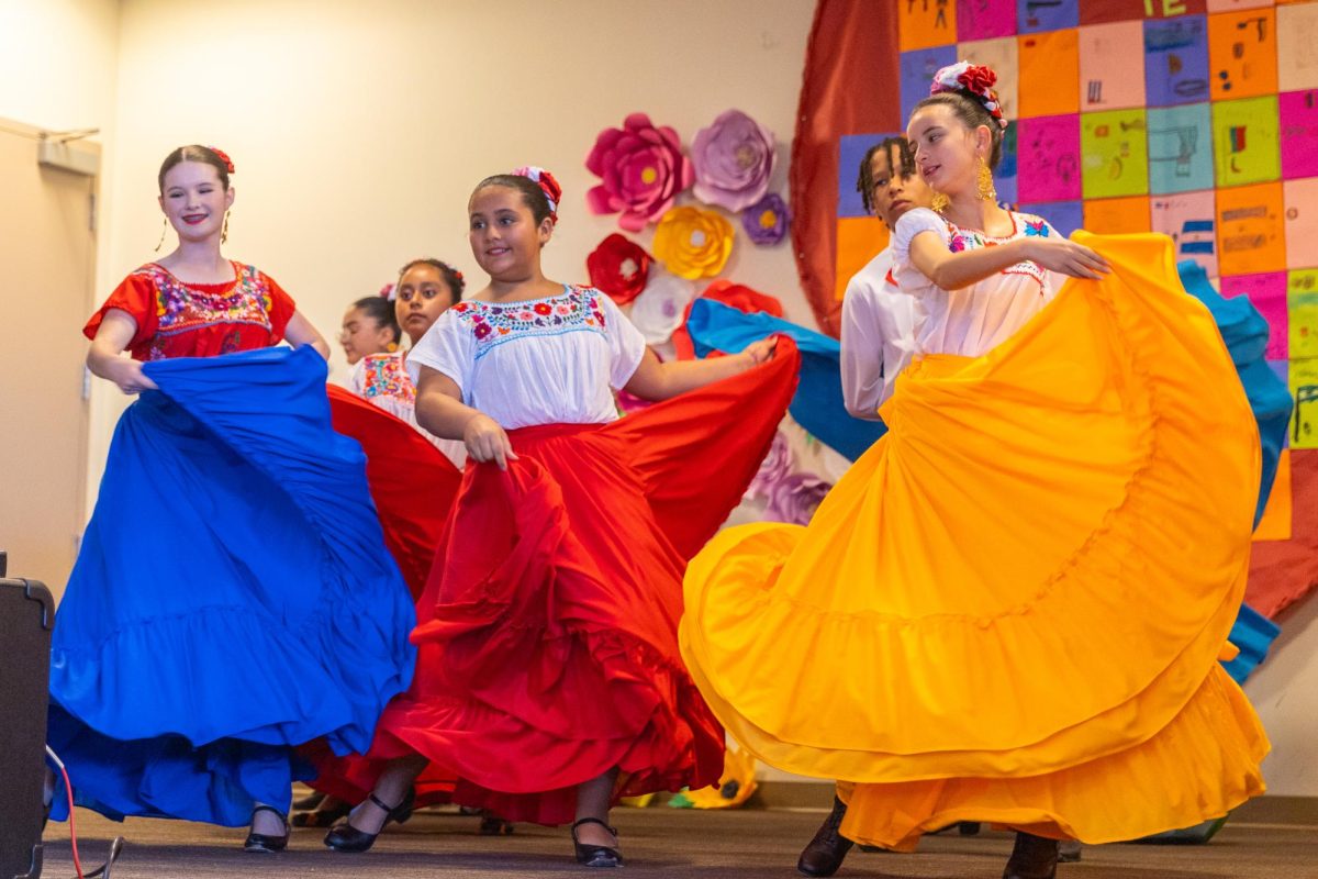 Performers twirl their colorful dresses as part of their routine.   Photo by Katrina Lin