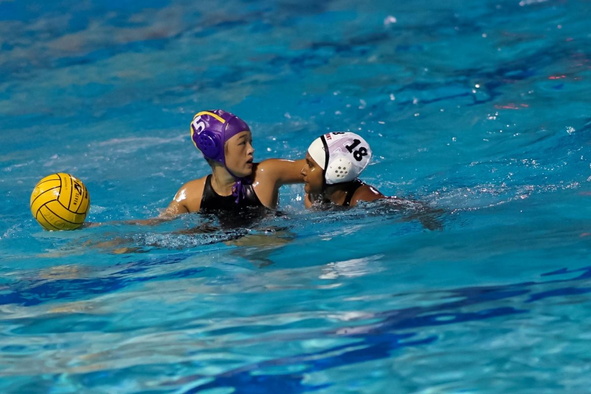 Junior Emily Lin prepares to pass the ball to a teammate.
