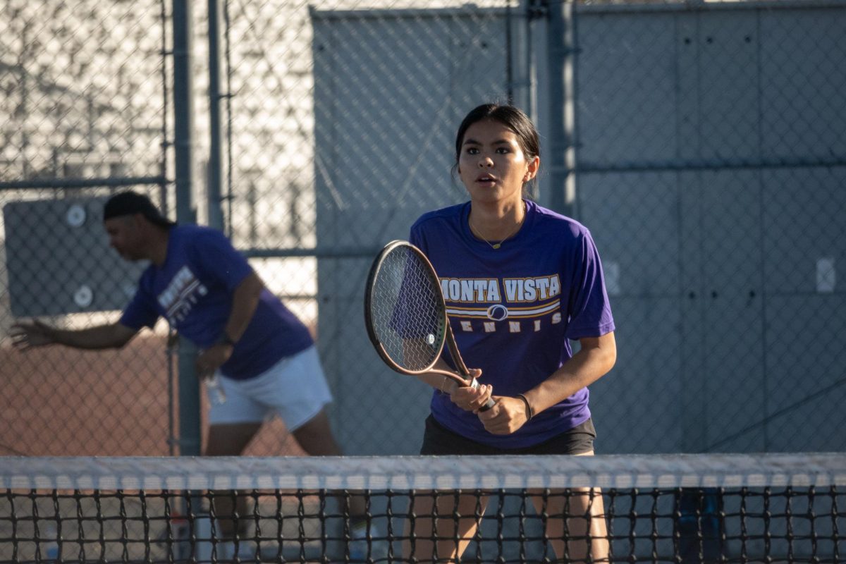 Junior Zoe Laurelle anticipates the incoming serve.