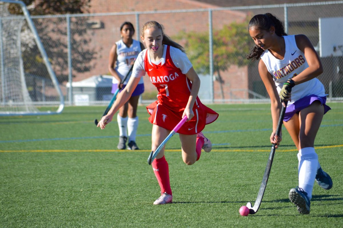 Junior and forward Monisha Preetham dribbles past an SHS player along the sideline.