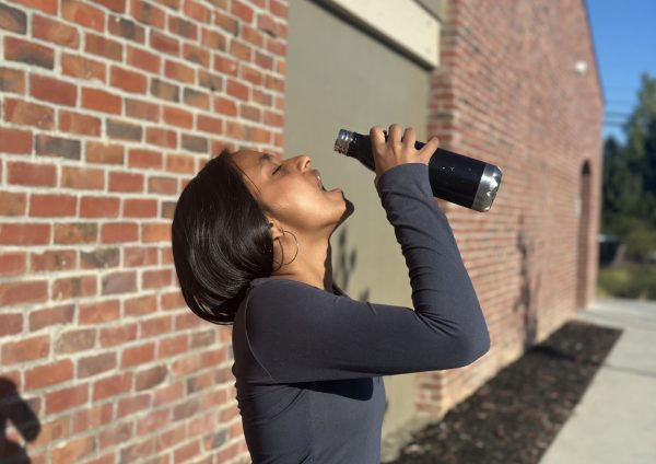 Junior Vaishnavi Katukam cools herself off by drinking some water